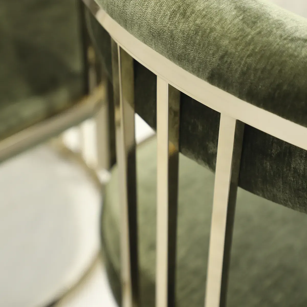 /storage/Luxury brass chair with elegant harp-shaped design by Castro Interiors.