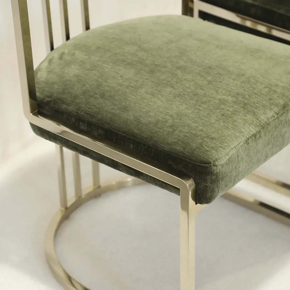 /storage/Luxury brass chair with elegant harp-shaped design by Castro Interiors.