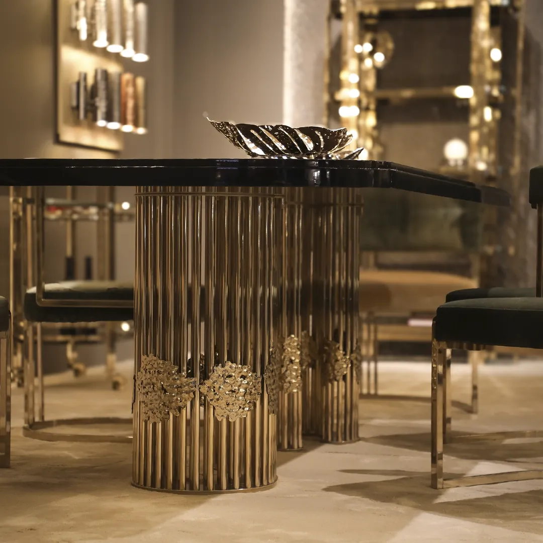 /storage/Magma Dining Table by Castro Lighting, a luxury dining table handcrafted in Portugal with a sculptural brass base inspired by molten magma and a refined tabletop for contemporary dining rooms.