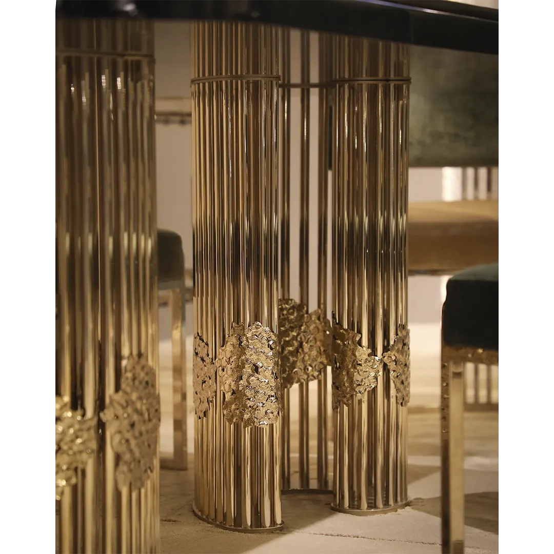 /storage/Magma Dining Table by Castro Lighting, a luxury dining table handcrafted in Portugal with a sculptural brass base inspired by molten magma and a refined tabletop for contemporary dining rooms.