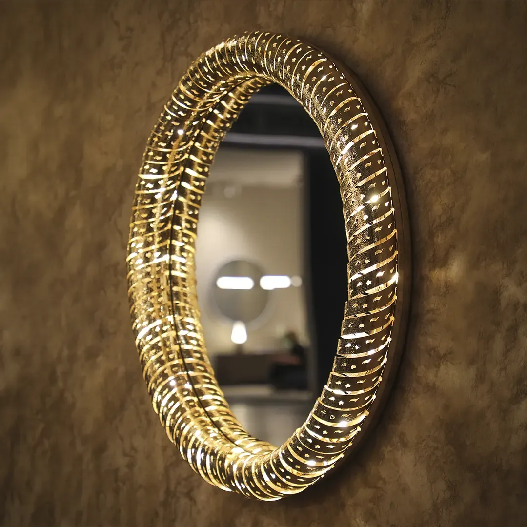 /storage/Luxury brass statement wall mirror by Castro Lighting with sculptural organic frame inspired by molten magma, handcrafted in Portugal for contemporary and sophisticated interiors.