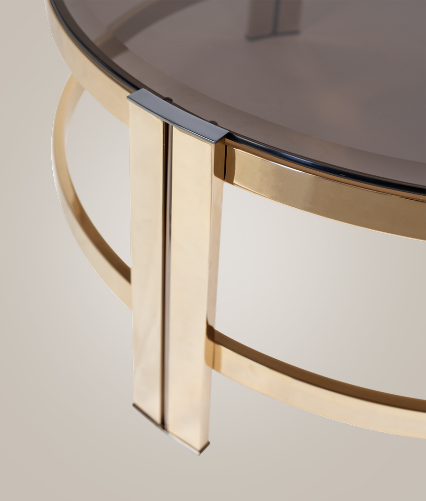 /storage/Luxury brass and glass Marie center table with two-tier design, an elegant accent piece for sophisticated interiors.