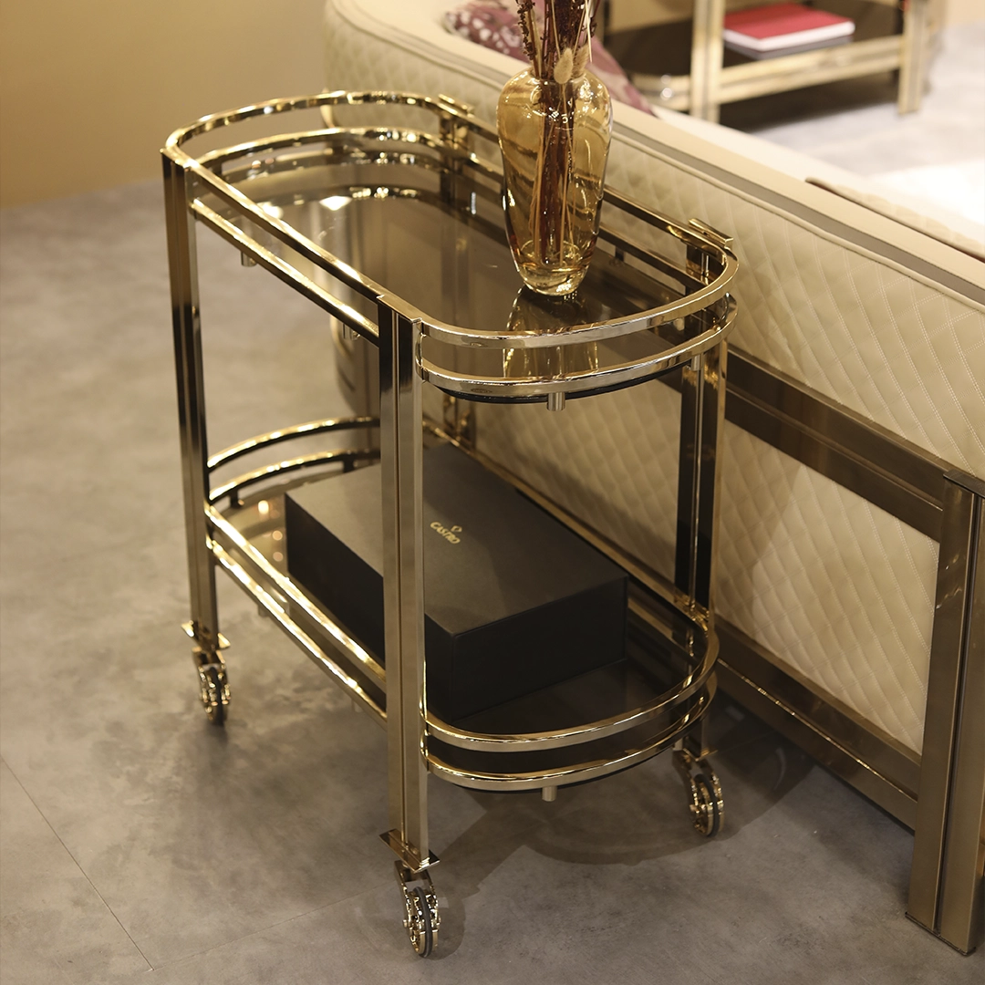 /storage/Luxury brass Marie tea cart with sleek design, spacious shelves, and modern detailing, a sophisticated serving cart for elegant interiors.