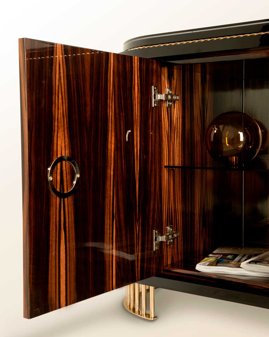 /storage/Luxury brass-accented Nautilus sideboard in ebony veneer with glass details, a modern classic design exuding naval inspiration and sophisticated elegance.