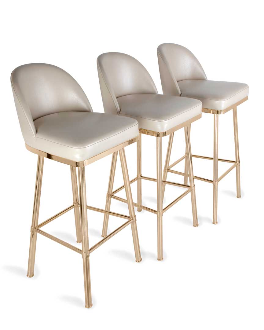 /storage/Luxury brass bar chair with gold-plated legs, black nickel accents, and curved upholstered body, blending Art Deco style with modern femininity.