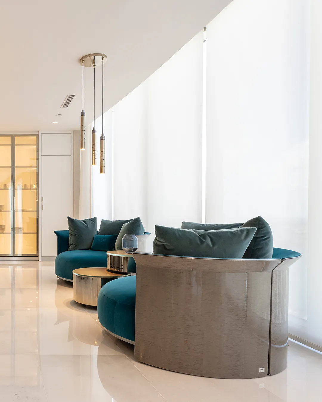 /storage/Luxury brass Gio pendant with geometric gold and nickel structure inspired by Italian modernist design.