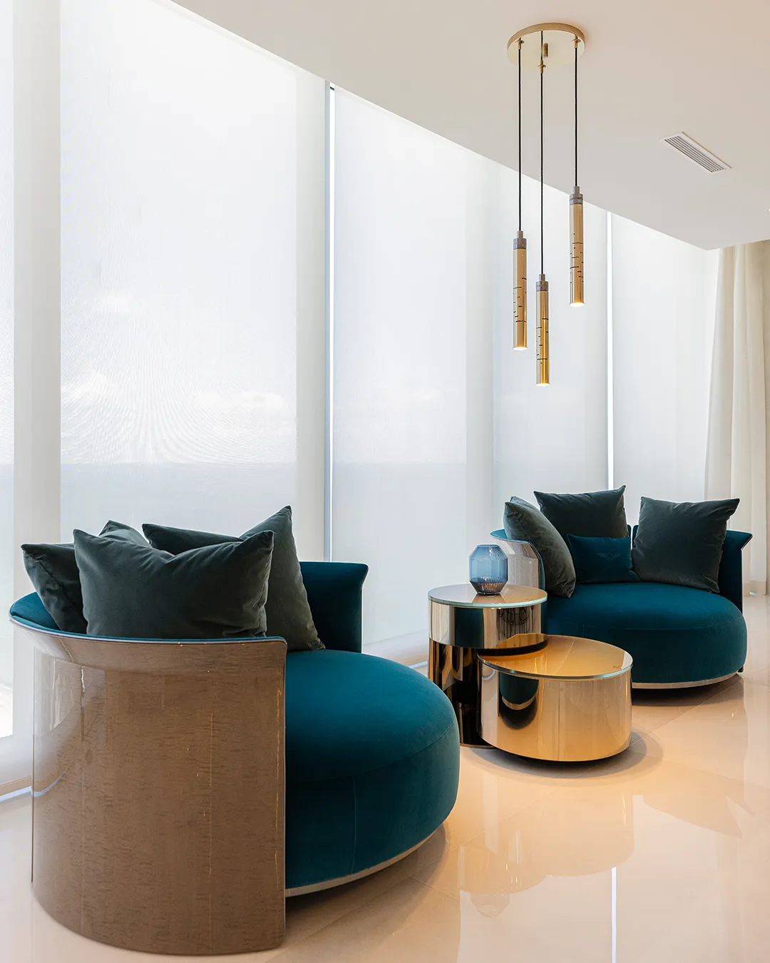 /storage/Luxury brass Gio pendant with geometric gold and nickel structure inspired by Italian modernist design.