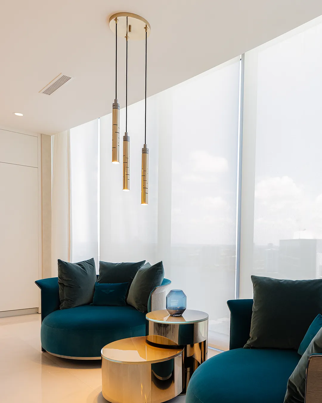 /storage/Luxury brass Gio pendant with geometric gold and nickel structure inspired by Italian modernist design.