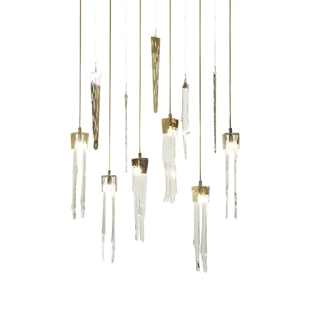 /storage/Luxury brass suspension with handcrafted crystal details inspired by natural stalactites, combining elegance and sculptural design.