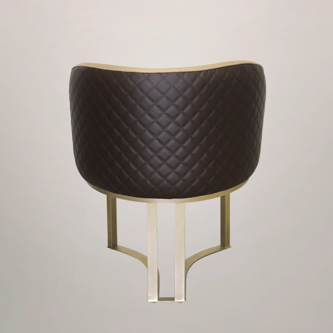 /storage/Luxury brass chair with beige leather upholstery and twisted brass detailing, blending feminine charm with refined contemporary design.