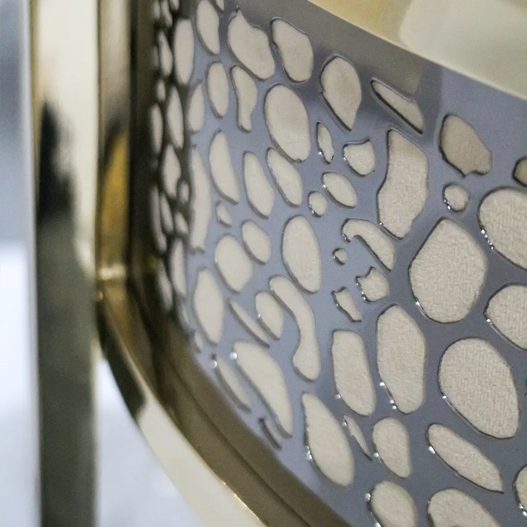 /storage/Luxury brass bar chair with beige upholstery and hand-sculpted giraffe print backrest, blending regal elegance with safari-inspired design.