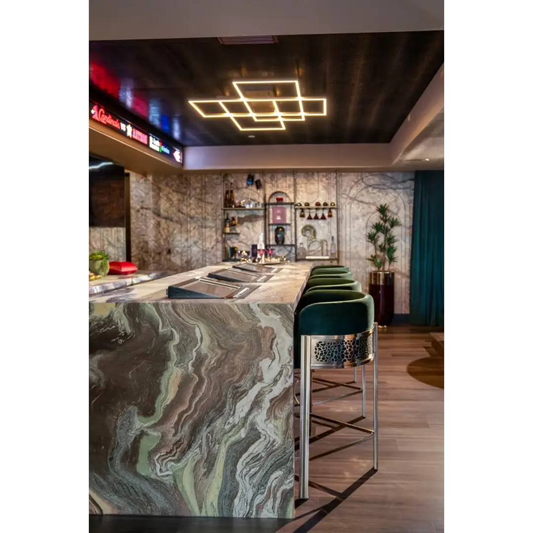 /storage/Luxury brass bar chair with beige upholstery and hand-sculpted giraffe print backrest, blending regal elegance with safari-inspired design.