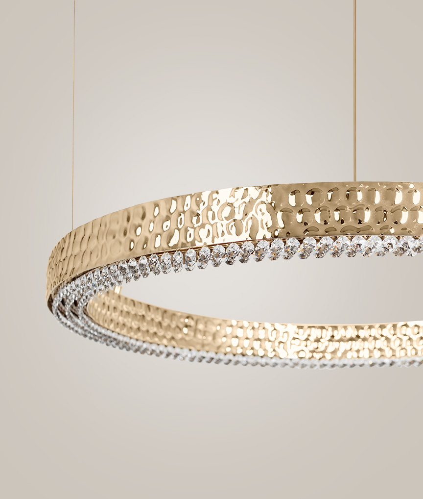 /storage/Luxury brass suspension with delicate crystal accents and minimalist design by Castro Lighting.