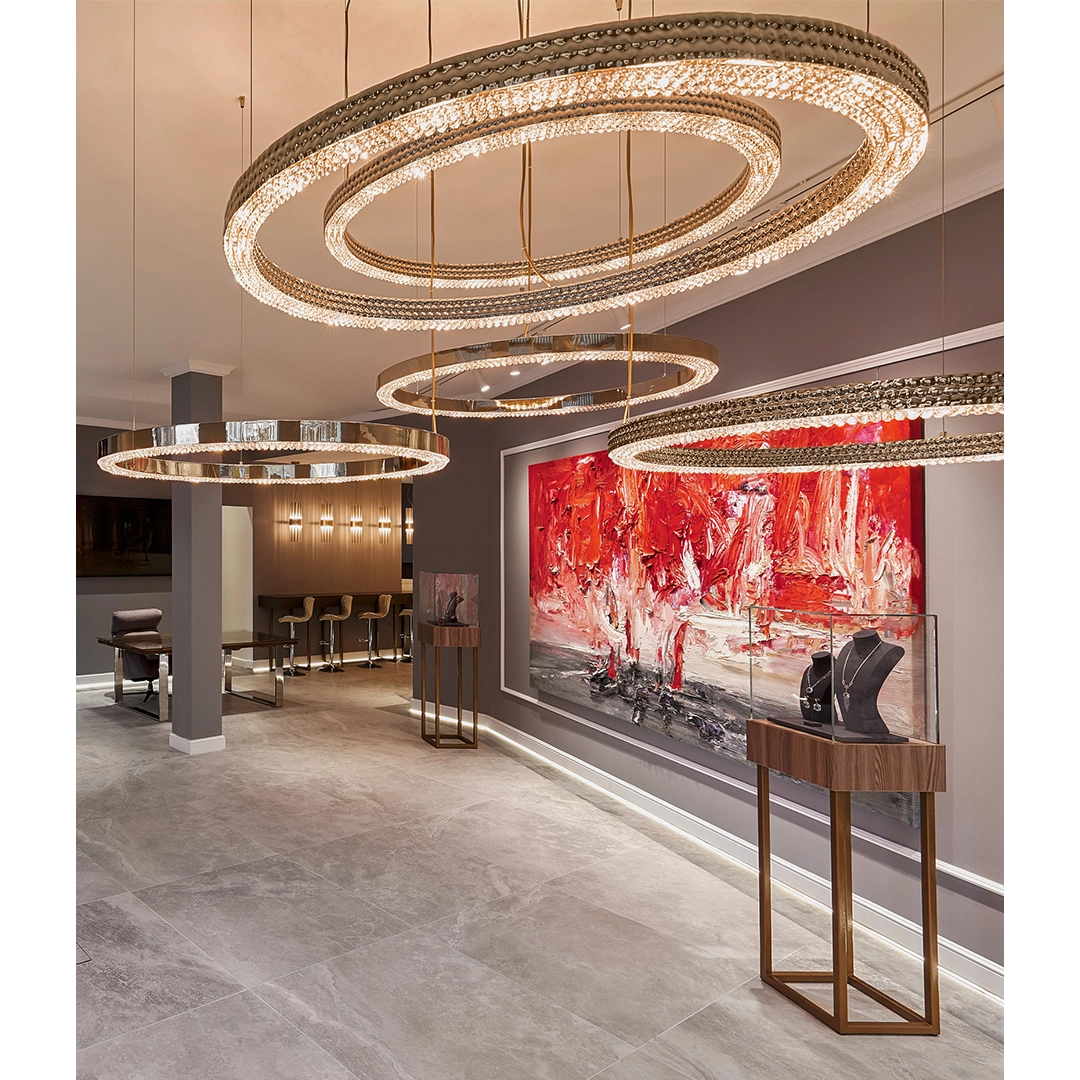 /storage/Luxury brass suspension with delicate crystal accents and minimalist design by Castro Lighting.