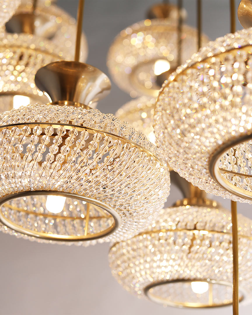 /storage/Luxury brass Mystic Suspension chandelier with clear crystal strips in a round, slightly flattened design, blending classical style and timeless sparkle for grand interiors.
