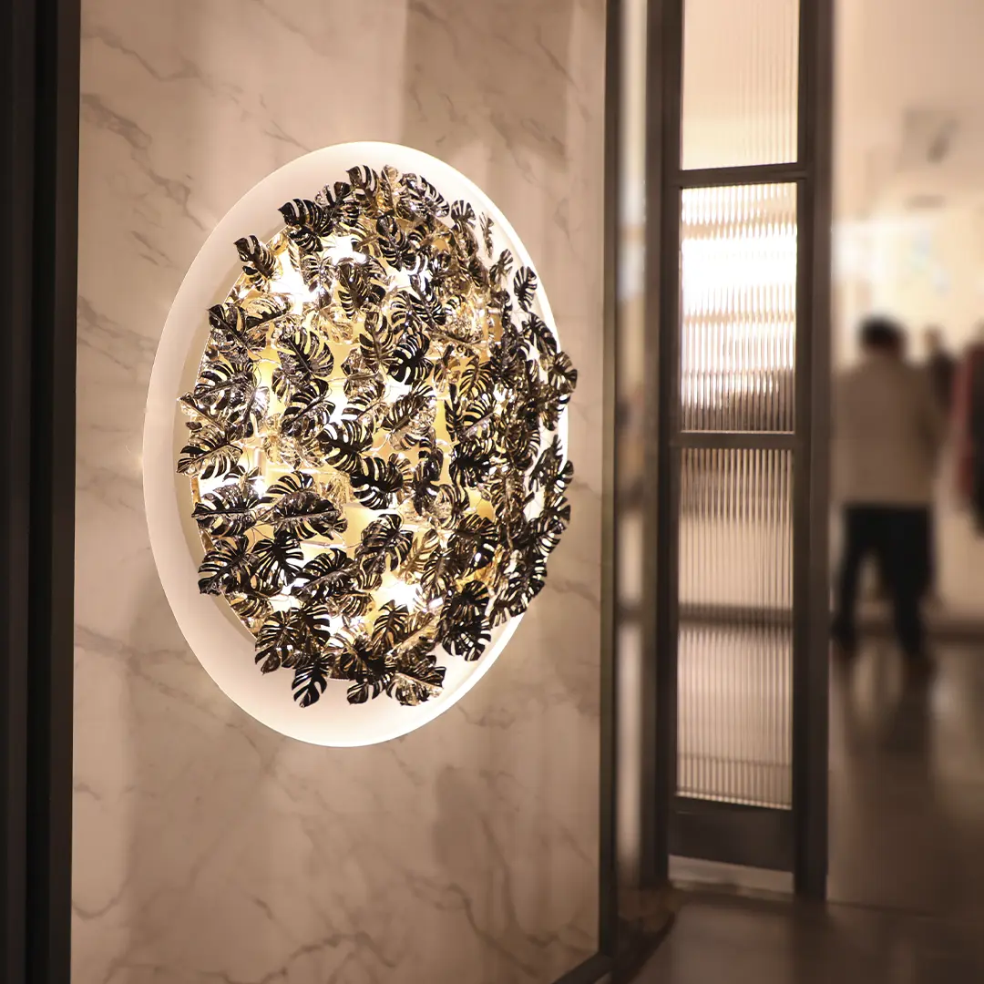 /storage/Luxury brass Rainforest Round Wall Light with gold-plated brass leaves and clear crystal glass details, featuring raindrop and butterfly motifs for refined modern interiors.