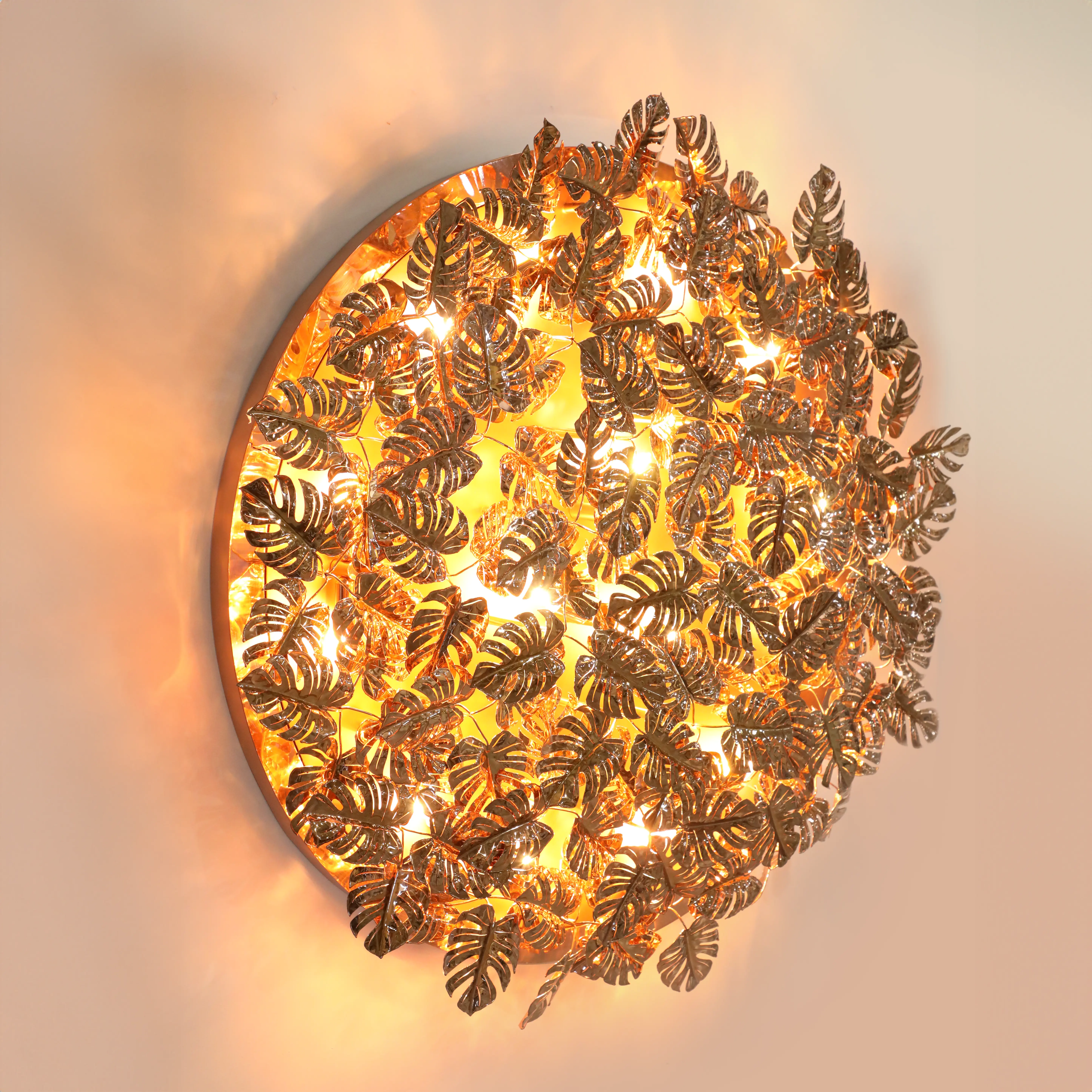 /storage/Luxury brass Rainforest Round Wall Light with gold-plated brass leaves and clear crystal glass details, featuring raindrop and butterfly motifs for refined modern interiors.