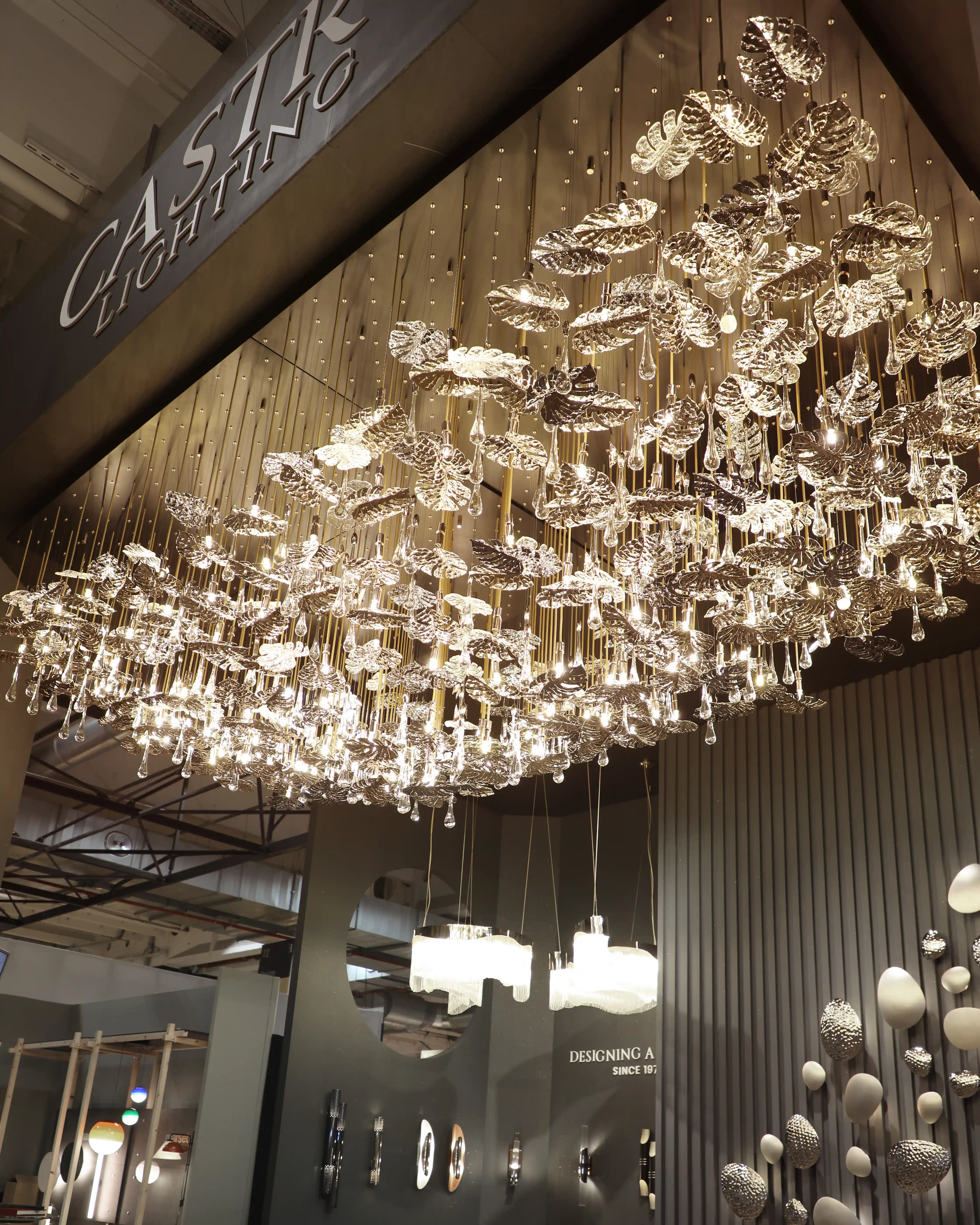 /storage/Luxury brass suspension with nature-inspired raindrop and butterfly details by Castro Lighting.