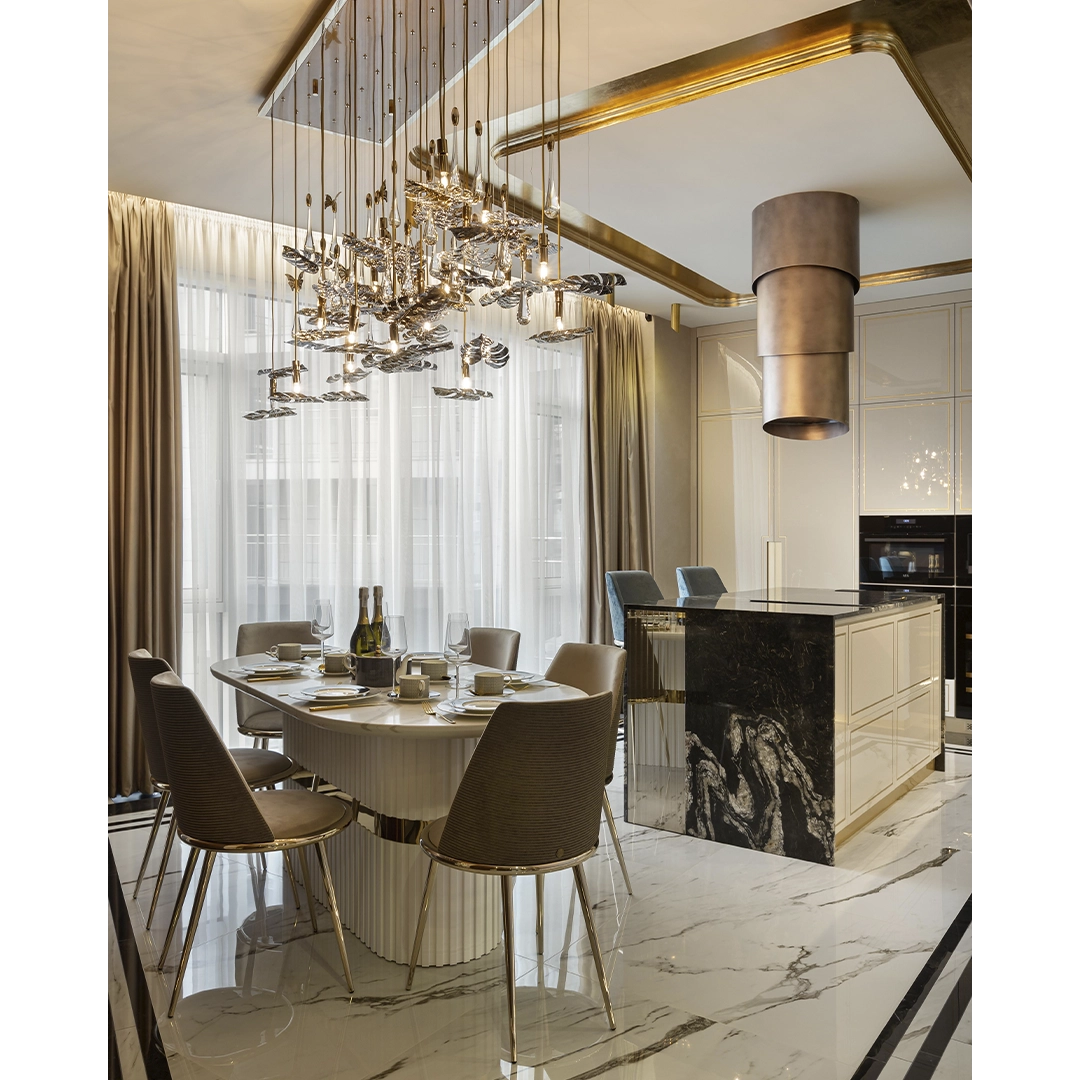 /storage/Luxury brass suspension with nature-inspired raindrop and butterfly details by Castro Lighting.