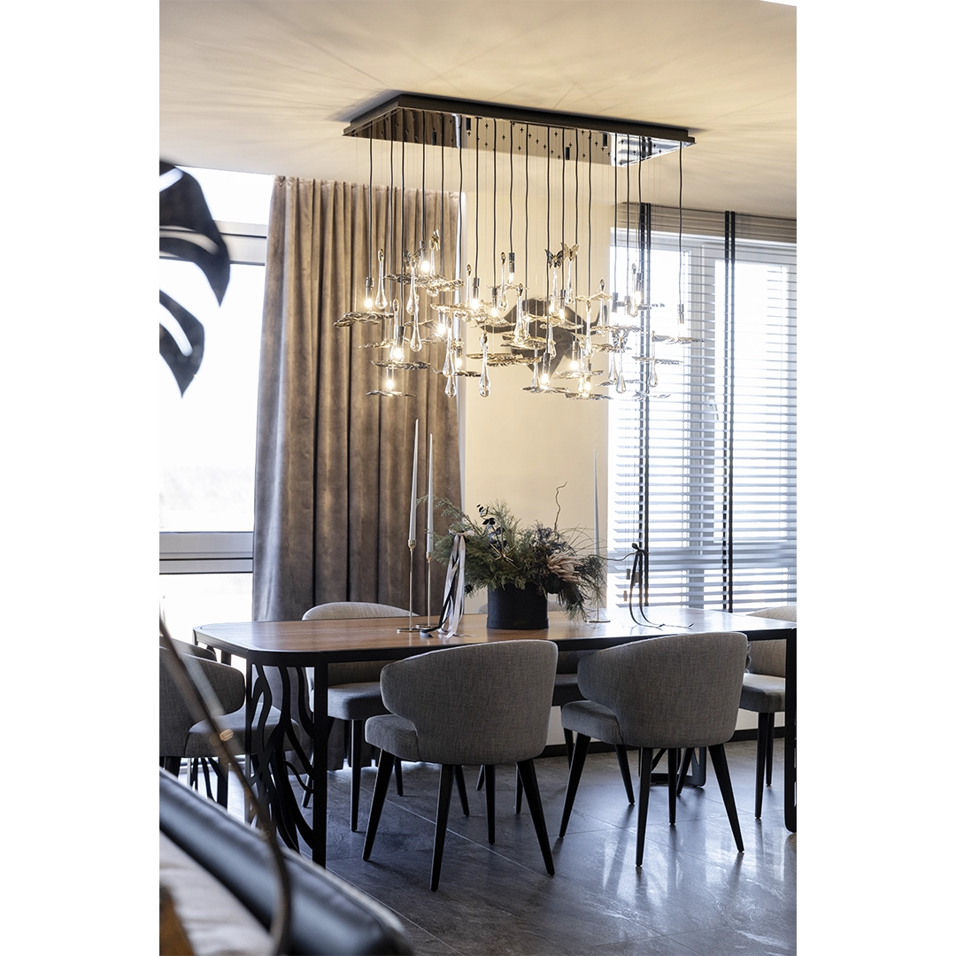 /storage/Luxury brass suspension with nature-inspired raindrop and butterfly details by Castro Lighting.