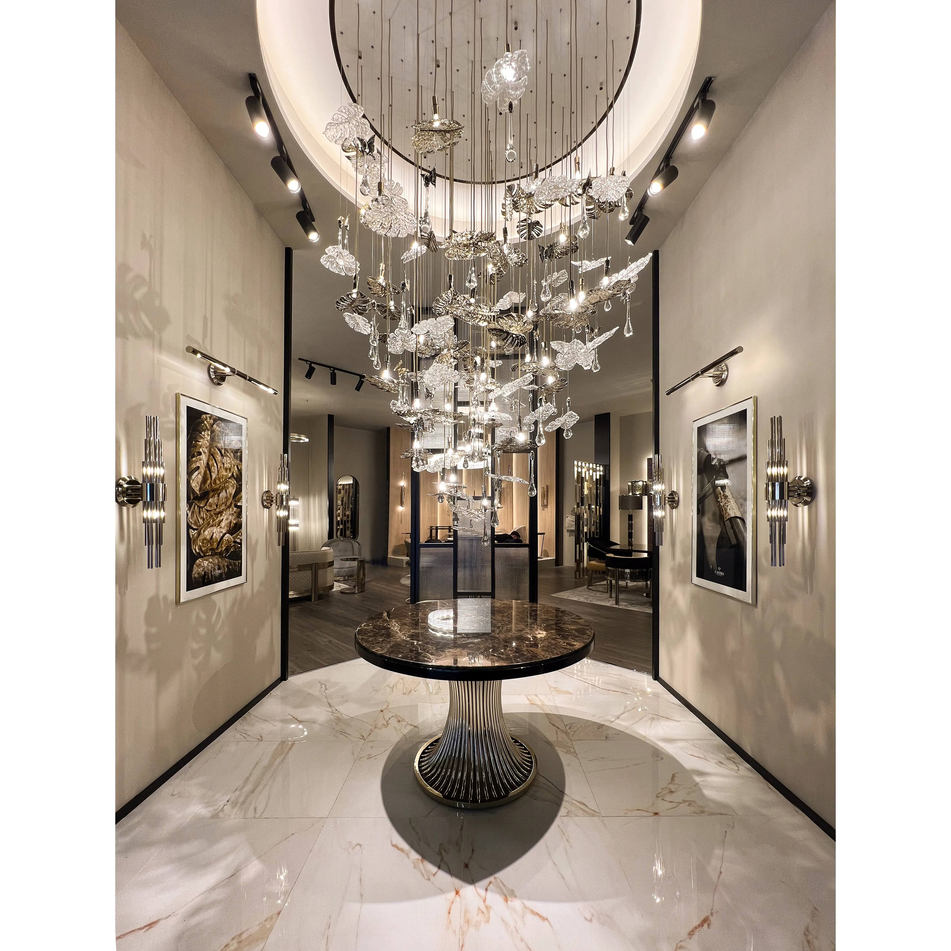 /storage/Luxury brass suspension with nature-inspired raindrop and butterfly details by Castro Lighting.