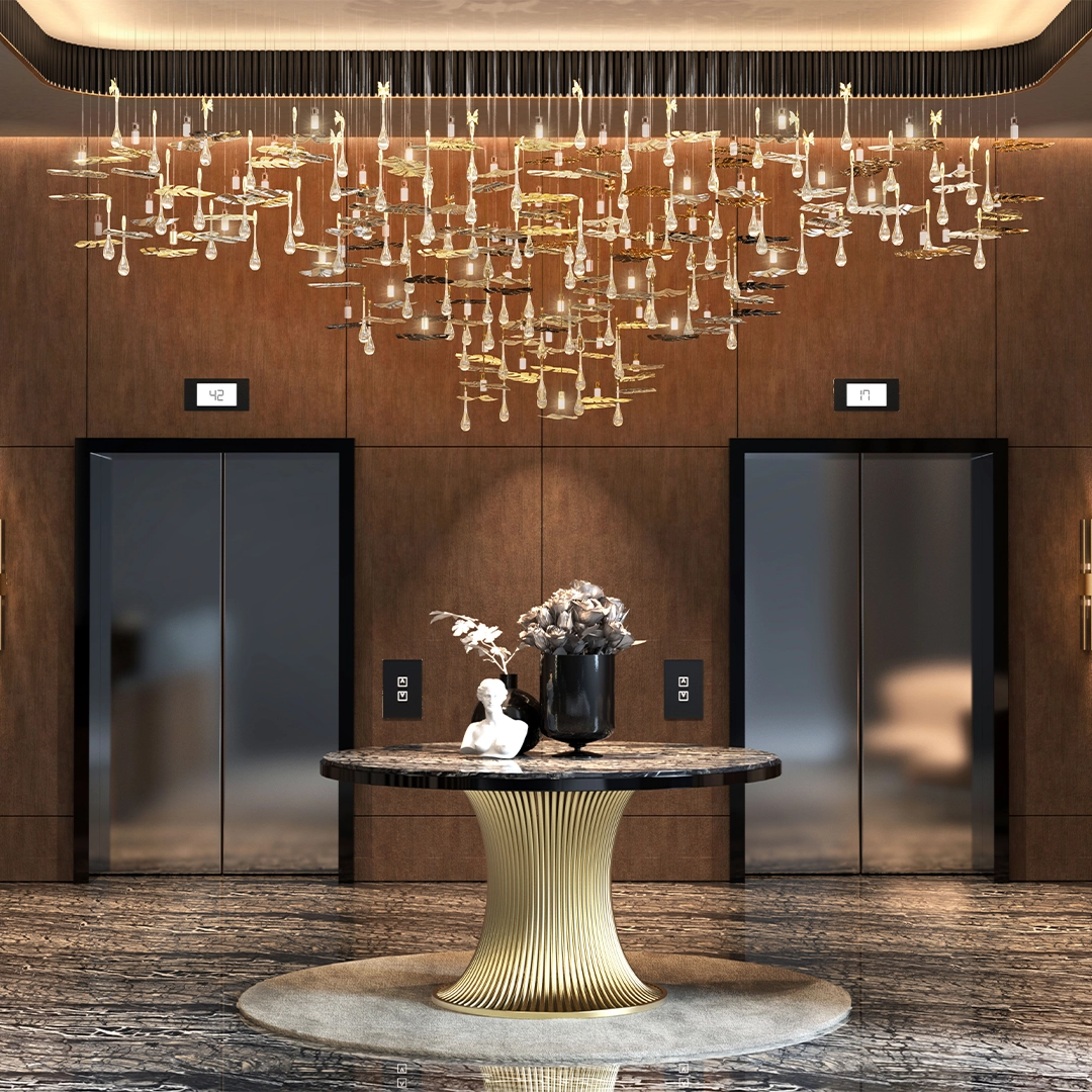 /storage/Luxury brass suspension with nature-inspired raindrop and butterfly details by Castro Lighting.