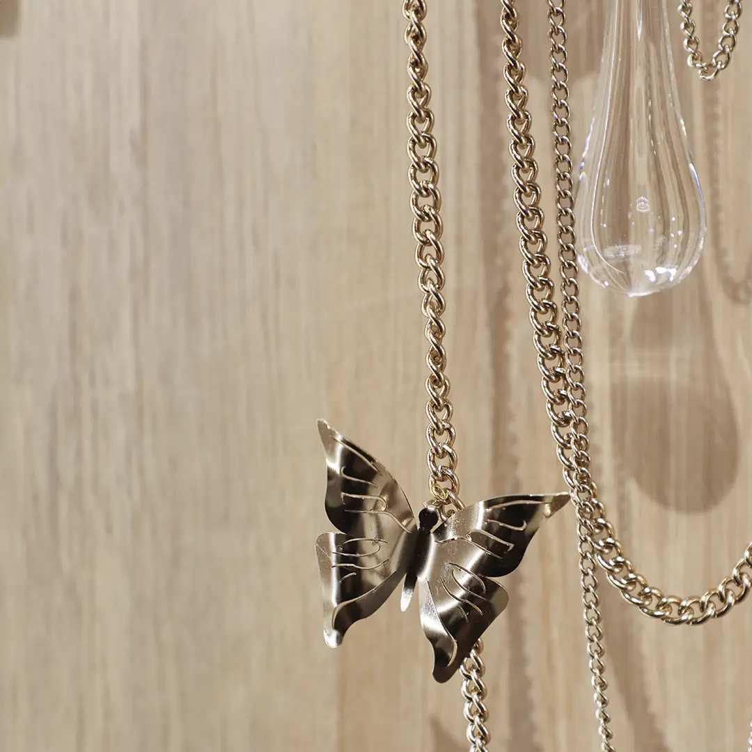 /storage/Luxury brass Rainforest Wall Light with gold-plated brass and hand-applied clear crystal glass, adorned with raindrops and butterflies for refined elegance.