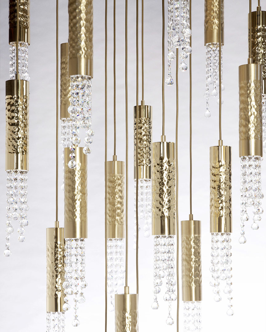 /storage/Luxury brass suspension inspired by Moroccan architecture, designed for grand interiors with bold forms and intricate detailing.
