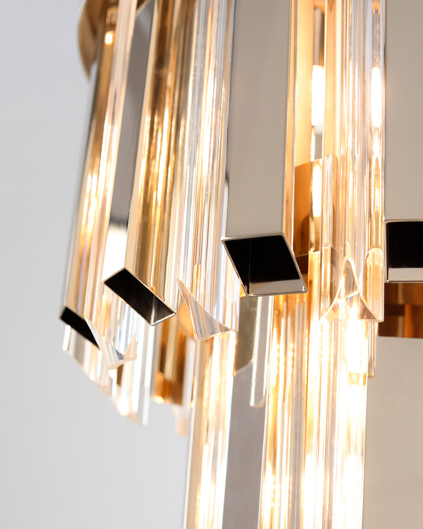 /storage/Luxury brass Skylar Wall Light with gold-plated brass and glass in a cosmic-inspired design.
