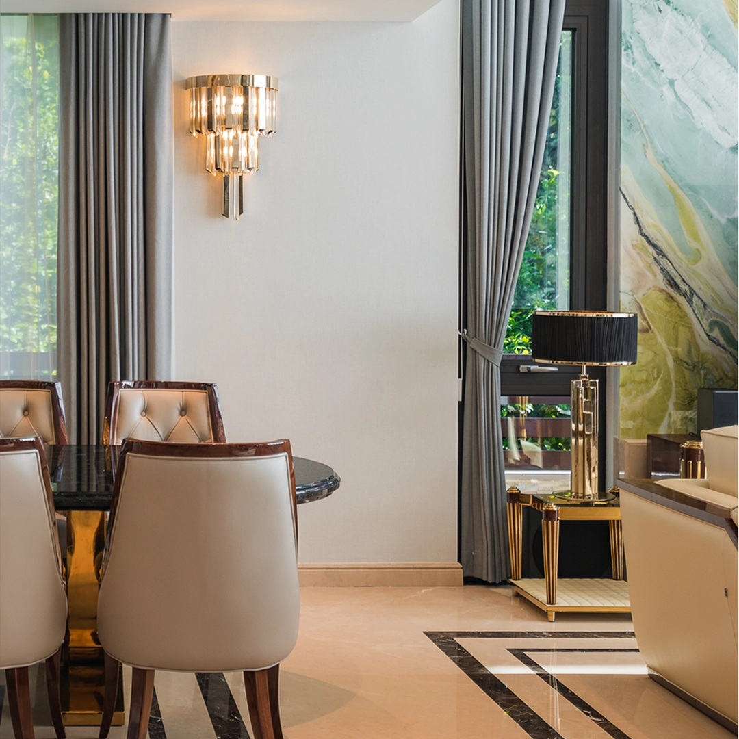 /storage/Luxury brass Skylar Wall Light with gold-plated brass and glass in a cosmic-inspired design.