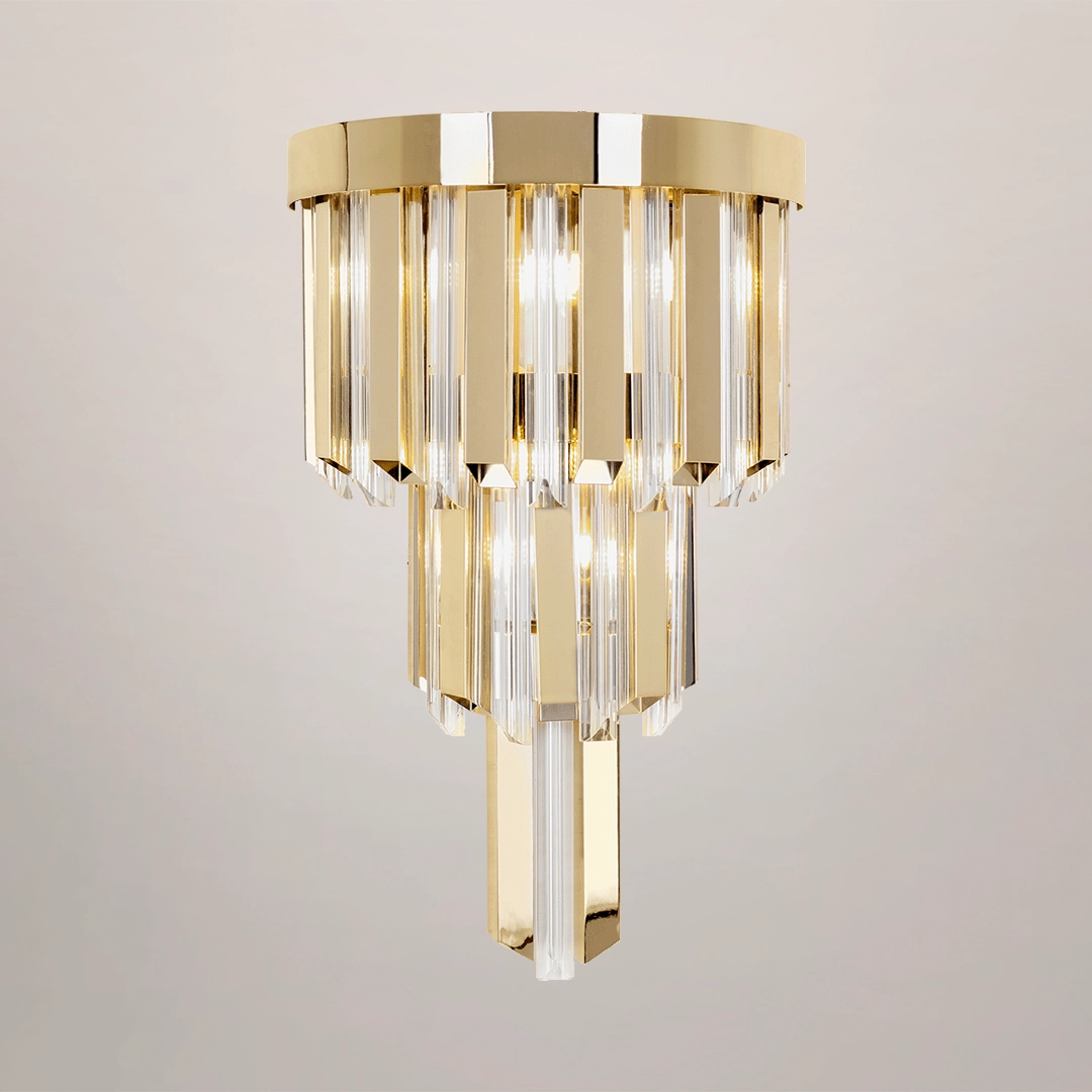 /storage/Luxury brass Skylar Wall Light with gold-plated brass and glass in a cosmic-inspired design.