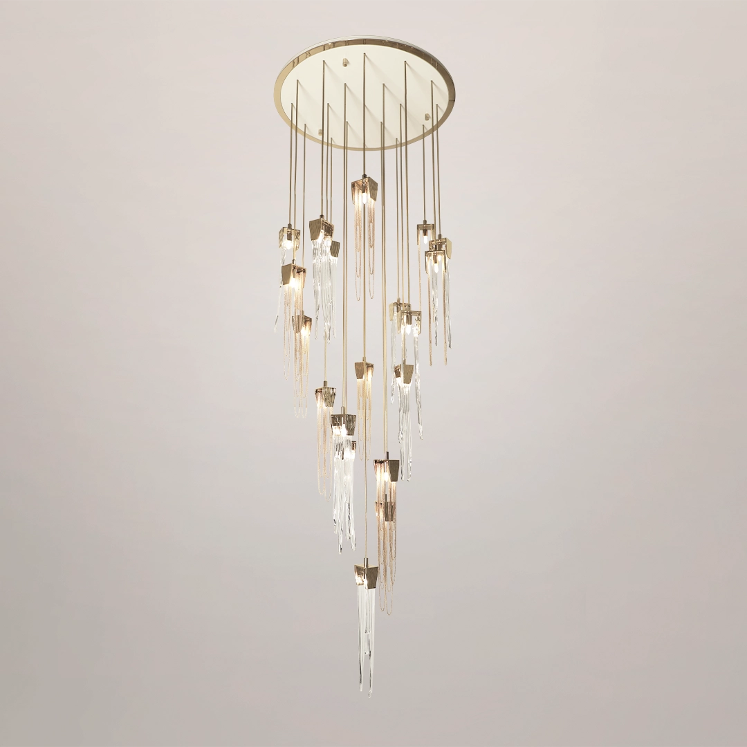 /storage/Luxury brass suspension with handcrafted crystal details inspired by natural stalactites, combining elegance and sculptural design.