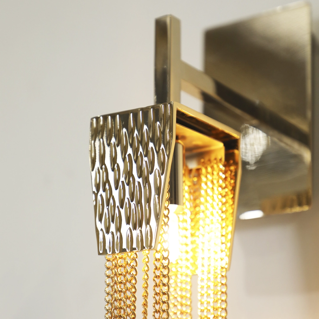 /storage/Luxury brass Stala Wall Light with crystal details, inspired by stalactites, handcrafted for modern elegant interiors.