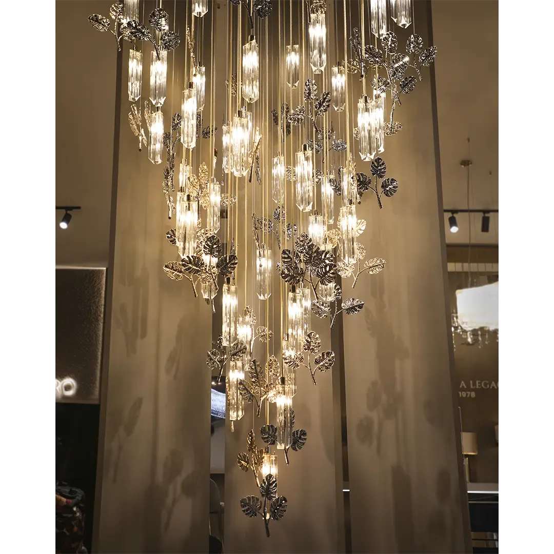 /storage/Luxury gold-plated brass suspension with handcrafted leaf motifs, inspired by nature and designed to bring organic elegance to any space.