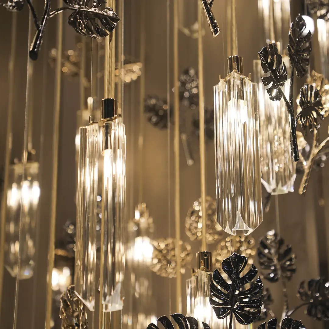 /storage/Luxury gold-plated brass suspension with handcrafted leaf motifs, inspired by nature and designed to bring organic elegance to any space.