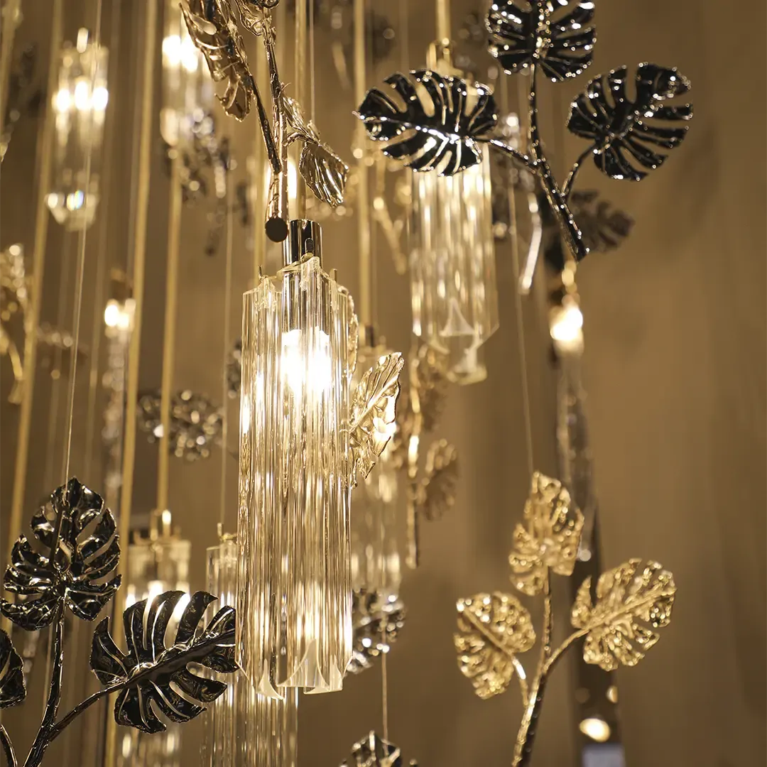 /storage/Luxury gold-plated brass suspension with handcrafted leaf motifs, inspired by nature and designed to bring organic elegance to any space.