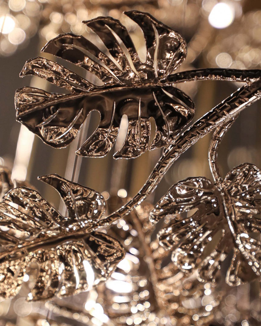 /storage/Luxury gold-plated brass suspension with handcrafted leaf motifs, inspired by nature and designed to bring organic elegance to any space.