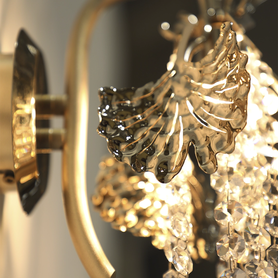 /storage/Luxury brass Tuscania Wall Light with gold-plated leaves and crystal accents, inspired by Tuscan landscapes, adding elegance and refined sculptural beauty to interiors.