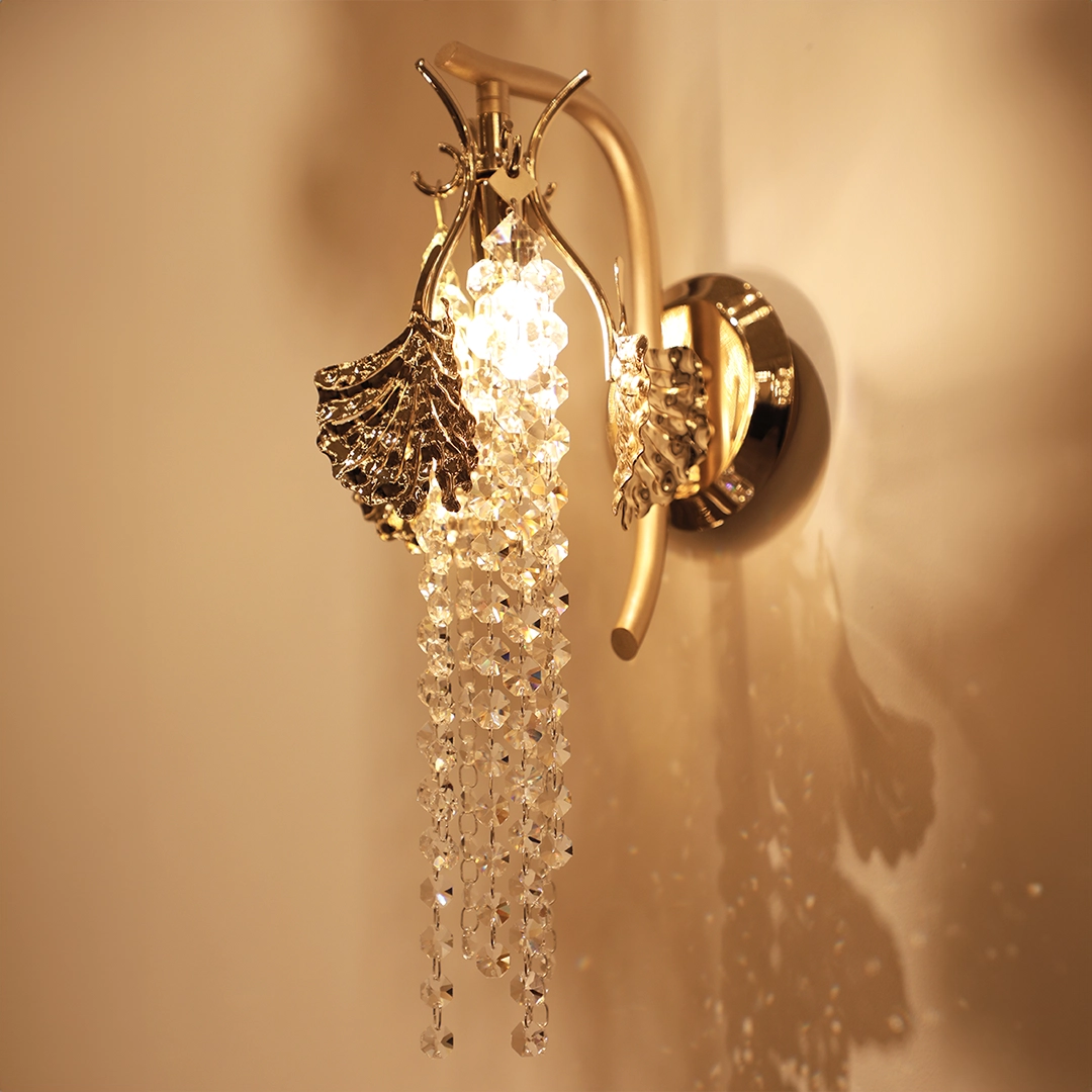 /storage/Luxury brass Tuscania Wall Light with gold-plated leaves and crystal accents, inspired by Tuscan landscapes, adding elegance and refined sculptural beauty to interiors.