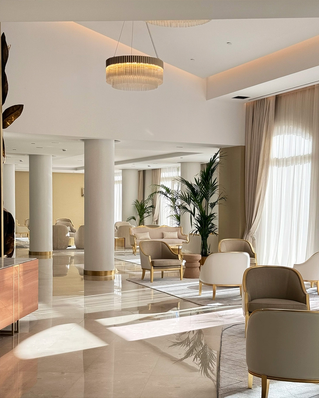 Wellness center lounge featuring the Arcade suspension by Castro as the main lighting piece, part of 2025 interior design collaborations.