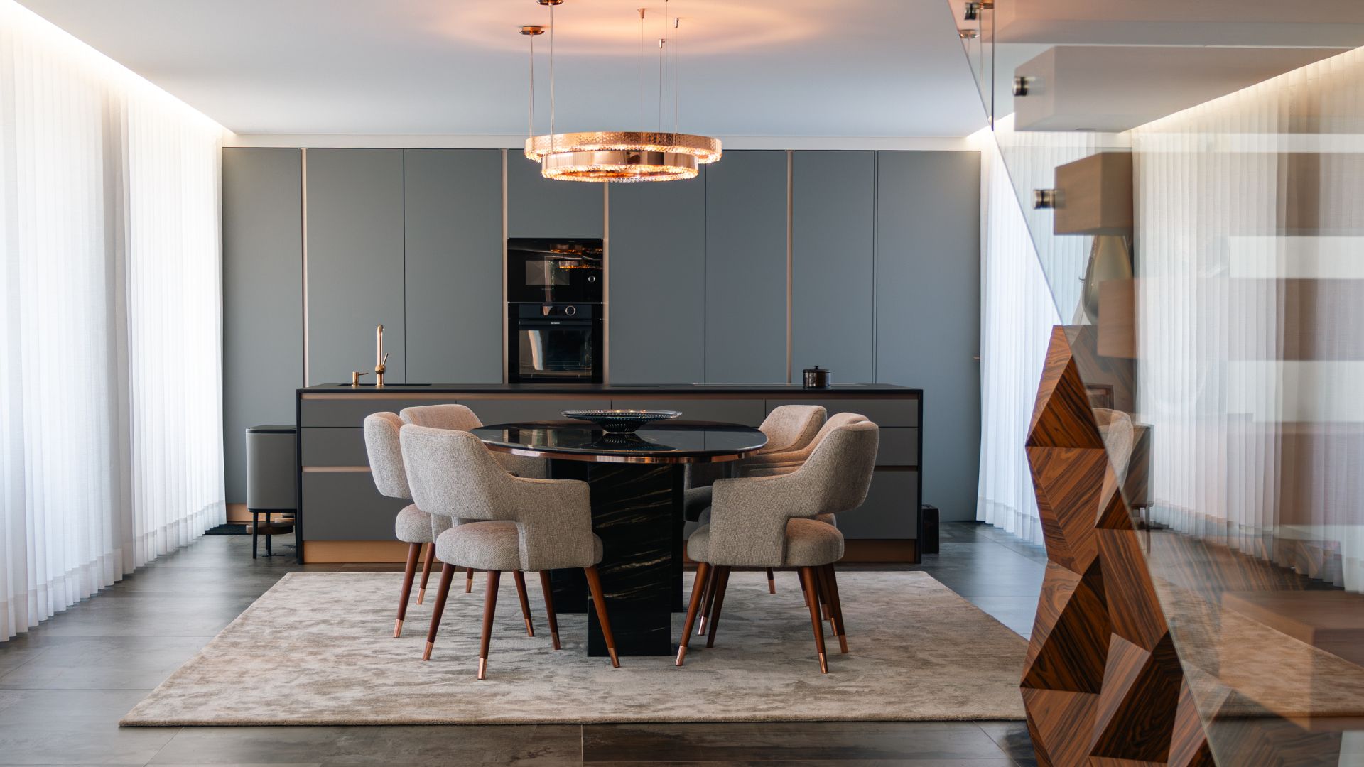 Metis Suspension by Castro Lighting in a refined dining interior designed by Alfaiate Interiores, featuring a copper brass finish that enhances the space with a warm and sophisticated glow.