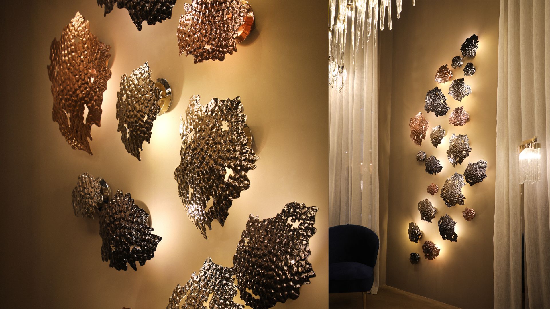 Modern sculptural wall light with warm metallic finish creating ambient interior lighting