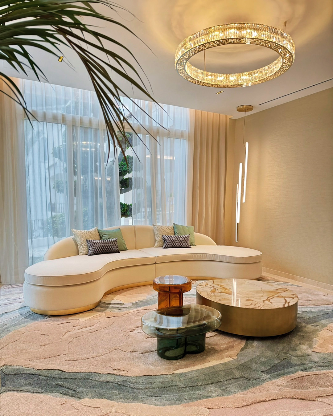 Lounge area featuring a Castro suspension light, highlighting contemporary interior design collaborations in 2025.