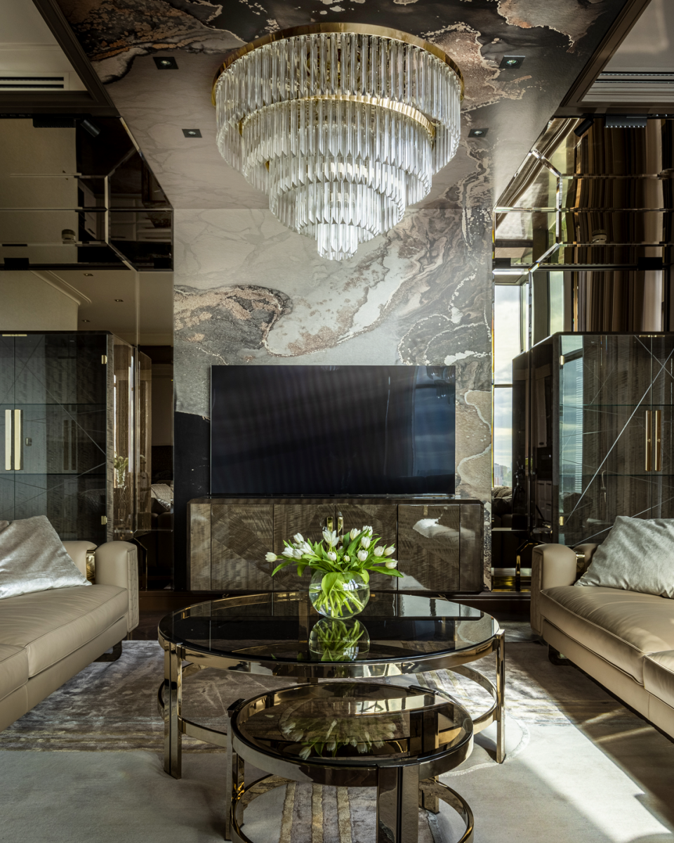 This posh yet sophisticated project drew a great deal of inspiration from beautiful modern hotels, luxurious high-end villas, and beyond that, from the stunning places around the world along with exquisite architecture and avant-garde allure, which made this residential project flourish. Designed and decorated by Marina Putilovskaya, this lavish private condo features Avolto Suspension, Marie Center Table, Mondrian Wall Light, Royal Suspension, Skylar Suspension, and Twist Suspension by Castro Lighting. 