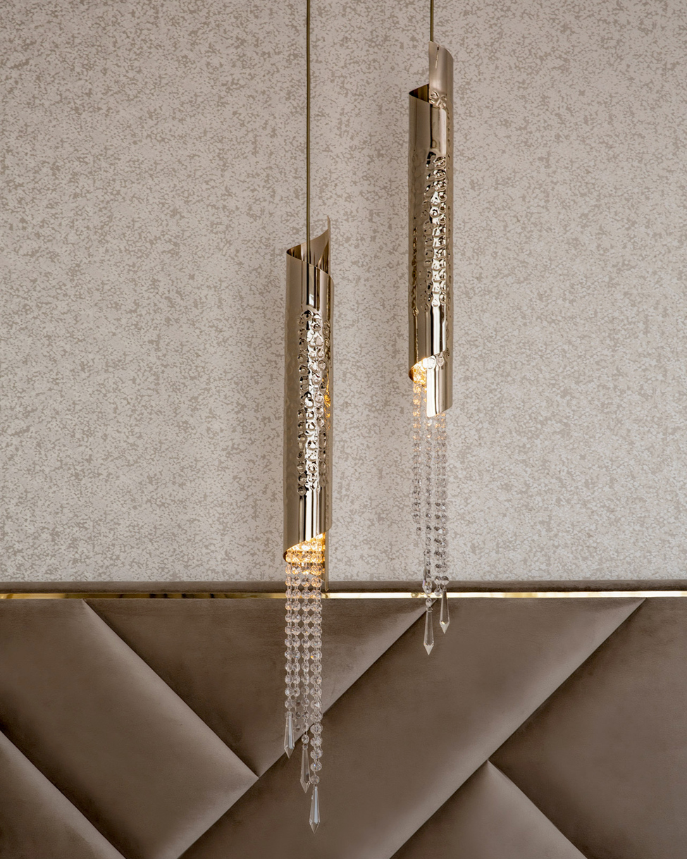 Elegant Avolto pendant light with hammered 24k gold-plated brass tubes and hand-assembled crystal accents